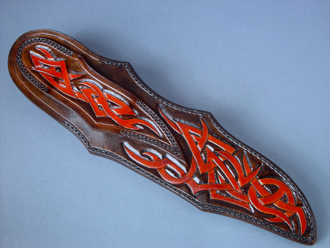 "Tribal" (Helhor pattern), sheath back site view. Belt loop is fully tooled, hand-dyed, hand finished and stitched in double row stitching for durability, pattern extends throughout sheath back.