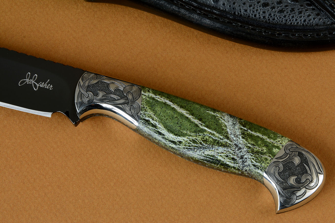 "Vulpecula" obverse side view in hot-blued O1 high carbon tungsten vanadium tool steel alloy, hand-engraved 304 stainless steel bolsters, Silver Leaf Serpentine gemstone handle, Frog skin inlaid in hand-carved leather sheath