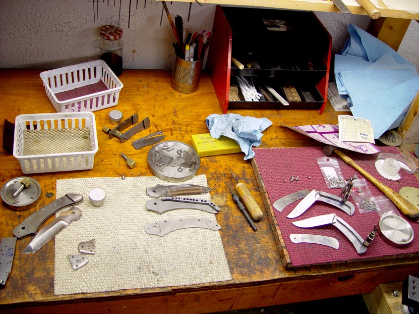Folder bench: where I work on folding knives. Various liner lock folders in construction