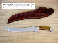 "Deimos" 440C high chromium stainless steel blade, hollow ground, mirror finished, hand-engraved 304 high chromium high nickel stainless steel bolsters, Tiger Eye Quartz gemstone handle, hand-carved and tooled leather sheath