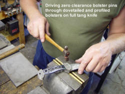 Driving zero clearance pins in bolsters and through knife tang