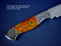 "Nekkar" obverse side view in 440C high chromium stainless steel blade, hand-engraved 304 stainless steel bolsters, Morgan Hill Poppy Jasper gemstone handle, Ostrich leg skin inlaid in hand-carved leather sheath