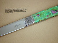 "Shaula" ATS-34 high molybenum stainless steel blade, hand-engraved 304 stainless steel bolsters, Ruby in Fuchsite gemstone handle, lizard skin inlaid in hand-carved leather shoulder