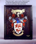 Coat of arms, backboard and frame for "Warrior's Quill rapier and parrying dagger. Board is embellished with machine cut and engraved anodized aluminum and lacquered brass mosaic on antiqued oak handmade frame