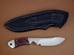 "Acamar" reverse side view. Basketweave tooling covers sheath back and belt loop. This is a tough working knife.