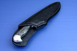 "Aldebaran" sheath mouth view. Sheath is 9-10 oz. thick leather shoulder, dyed black, sealed with acrylic, inlaid with large ostrich leg skin panels