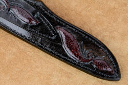 "Aldebaran" sheath lower back detail. Full hand carving and inlays of burgundy ostrich leg skin, sealed with acrylic for resistance to elements