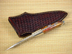 "Alegre" spine edgework, filework detail. Filework style is called "lightning" and tang is fully tapered, with dovetailed bolsters and gemstone handle scales
