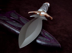 "Amethystine" point detail. Blade is high chromium mirror polished 440C stainless steel. Sheath is thick and tough with full welts.