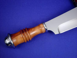 "Andrimne" master chef's knife, reverse side handle view. Peach hardwood is tightly fitted to the stainless ferrules of the handle, solid and protected from moisture.