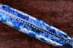 "Andromeda" spine detail doublet gemstone handle detail view in T3 deep cryogenically treated CPM 154CM powder metal technology high molybdenum stainless steel blade, 304 stainless steel bolsters, K2 Azurite Granite gemstone handle, hand-carved leather sheath inlaid with blue rayskin