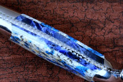 "Andromeda" inside handle enlargement gemstone handle detail view in T3 deep cryogenically treated CPM 154CM powder metal technology high molybdenum stainless steel blade, 304 stainless steel bolsters, K2 Azurite Granite gemstone handle, hand-carved leather sheath inlaid with blue rayskin