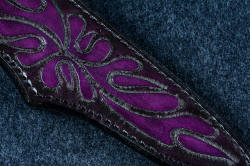 "Andromeda" sheath front detail view in T3 deep cryogenically treated CPM 154CM powder metal technology high molybdenum stainless steel blade, 304 stainless steel bolsters, Purple Turkish Jade gemstone handle, hand-carved, hand-dyed leather sheath