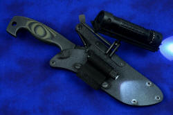 "Arctica" professional tactical, combat, rescue, counterterrorism knife, locking sheath shown with both flashlights shown operating on lowest settings