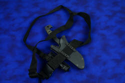 "Arctica" professional tactical, combat, rescue, counterterrorism knife, locking sheath mounted to sternum harness, back side view detailing mounting straps in blackened stainess steel