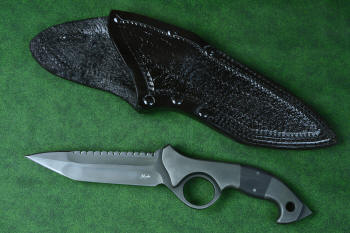 "Ari B'Lilah" Counterterrorism Tactical Knife, obverse side with leather sheath front view,  in T3 cryogenically treated CPM 154CM powder metal technology high molybdenum martensitic stainless steel blade, 304 stainless steel bolsters, Black G10 fiberglass/epoxy composite handle, hybrid tension tab-locking sheath in kydex, anodized aluminum, stainless steel, titanium
