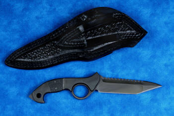 "Ari B'Lilah" counterterrorism, tactical, combat knife, reverse side view in T4 cryogenically treated 440C high chromium martensitic stainless steel blade, 304 stainless steel bolsters, carbon fiber handle, sheath in 9-10 oz. leather shoulder, basketweave stamp tooled, double row nylon stitching, stainess steel reinforcement and snaps, post locking secure