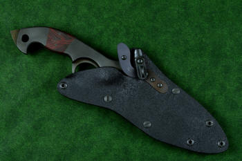 "Ari B'Lilah" counterterrorism, tactical, combat knife, sheathed view in T4 cryogenically treated 440C high chromium martensitic stainless steel blade, 304 stainless steel bolsters, red/black  G10 handle, hybrid tension tab locking sheath in kydex, anodized aluminum, anodized titanium, black oxide stainless steel