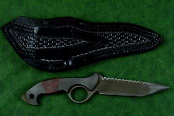 "Ari B'Lilah" counterterrorism, tactical, combat knife, reverse side view in T4 cryogenically treated 440C high chromium martensitic stainless steel blade, 304 stainless steel bolsters, red/black  G10 handle, 9-10 oz. leather shoulder sheath with nylon double row stitching, black oxide stainless steel snaps and reinforcement