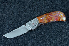 "Bellatrix" custom folding knife in T3 deep cryogenically treated ATS-34 high molybdenum martensitic stainless steel blade, hand-engraved 304 stainless steel bolsters, differerentially anodized 6AL4V titanium liners, Roostertail Agate gemstone handle, 304 stainless steel fasteners with garnet faceted gemstones