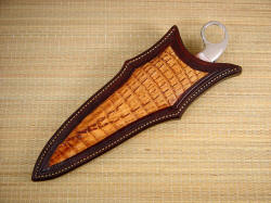 "Bulldog" sheathed view. Hand-carved sheath is inlaid with real caiman skin, heavy in texture and pattern, with tail spine rise accented.