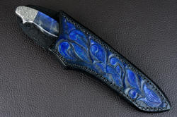 "Carina" sheathed view. Sheath is deep and protective, with a high back and bit of handle and bolster display