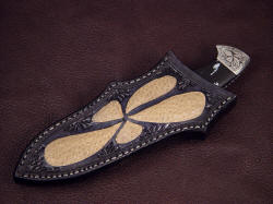 "Chama" sheathed view. Sheath is deep yet allows enough of the rear bolster quillon to extract knife from sheath with ease