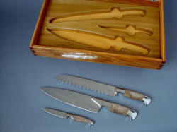 "Chef's Set" knives beside case. Knives are magnificent and unique creations, case is commensurate in quality, finish, and value