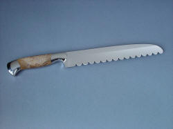"Conditor" Bread knife, reverse side view. Straight axis geometry allows knife to be an aggressive slicer with theatre curtain edge serration design.