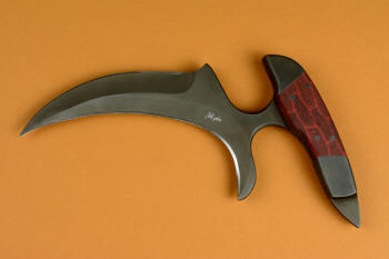 "Chela" karambit knife, obverse side view in T4 cryogenically treated 440C high chromium martenstic stainless steel blade, 304 austenitic stainless steel bolsters, Red and Black tortoiseshell pattern G10 handle