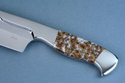 "Concordia" chef's knife, obverse side view. handle has a slight belly and rear quillon for support conforming to the hand, all stainless steel is easy to clean and maintain, requiring zero care.
