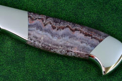 Concordia Chef's knife obverse side gemstone handle detail  in T3 cryogenically treated 440C high chromium stainless steel blades, 304 stainless steel bolsters, Lace Amethyst gemstone handles, leather book case with top grain cover