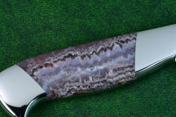 Concordia Chef's knife, reverse side lace amethyst gemstone knife handle view  in T3 cryogenically treated 440C high chromium stainless steel blades, 304 stainless steel bolsters, Lace Amethyst gemstone handles, leather book case with top grain cover
