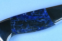 "Concordia" Master Chef's Custom Knife, reverse side handle macro view, no white reflector, correct gemstone density, in 440C deep cryogenically treated high chromium stainless steel blade, 304 stainless steel bolsters, Sodalite gemstone handle