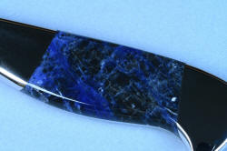 "Concordia" Master Chef's Custom Knife, obverse gemstone handle macro view, no reflector or glare, in 440C deep cryogenically treated high chromium stainless steel blade, 304 stainless steel bolsters, Sodalite gemstone handle