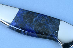 "Concordia" Master Chef's Custom Knife, obverse side macro view, with reflector, in 440C deep cryogenically treated high chromium stainless steel blade, 304 stainless steel bolsters, Sodalite gemstone handle