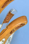 "Talitha" fine handmade chef's knife, in stand view in Black Cherry inlaid with Deschutes jasper
