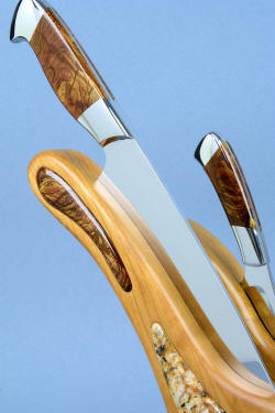 "Concordia and Talitha" fine handmade chef's knives, stand knife detail in stand view, in T3 cryogenically treated CPM154CM high molybdenum powder metal technology stainless steel blades, 304 stainless steel bolsters, Deschutes Jasper gemstone handles, stand of cherry hardwood, Deschutes Jasper gemstone, Delicatus Gold Granite