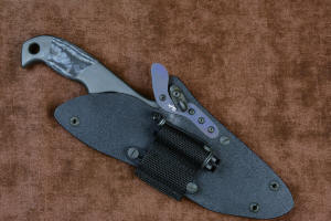 "Contego" Counterterrorism Tactical Knife, sheathed view with LIMA mounted, in T3 cryogenically treated CPM154CM  powder metal technology high molybdenum martensitic stainless steel blade, 304 stainless steel bolsters, Black/Gray G10 fiberglass/epoxy composite handle, hybrid tension tab-locking sheath in kydex, anodized aluminum, stainless steel, titanium