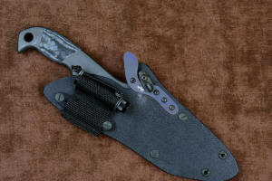 "Contego" Counterterrorism Tactical Knife, sheathed view with LIMA in upward mount position, in T3 cryogenically treated CPM154CM  powder metal technology high molybdenum martensitic stainless steel blade, 304 stainless steel bolsters, Black/Gray G10 fiberglass/epoxy composite handle, hybrid tension tab-locking sheath in kydex, anodized aluminum, stainless steel, titanium