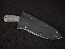 "Creature" CSAR tactical knife, sheathed view. Sheath is deep protective, tough and solid with all corrosion resistant components