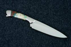 Reverse side view of "Cygnus" Custom handmade chef's knife in T3 cryogenically treated 440C high chromium stainless steel blade, 304 stainless steel bolsters, Cuprite mosaic gemstone handle, hand-tooled leather sheath