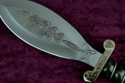 "Darach" Celtic dagger, obverse side, engraving detail. Note he golden to blue hue in the engaving cuts 