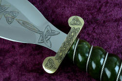 "Darach" celtic dagger, guard detail. Guard is hand-cast bronze, hand-engraved with triquetras and celtic braiding knotwork