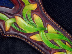 "Domovoi" sheath front face detail. I used successive dying process to get the color transitions and contrast on the sheath tooled leather