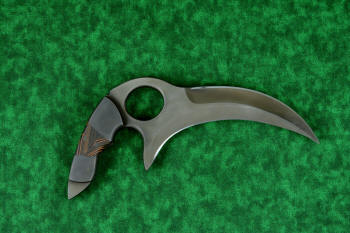 "Drepan" tactical karambit knife, reverse side view in T4 cryogenically treated 440C high chromium martensitic stainless steel blade, 304 stainles steel bolsters, orange/black G10 fiberglass epoxy composite laminate