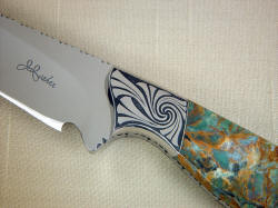 "Eridanus" obverse side front bolster detail. This photograph is a four power enlargement of the knife. Note sculpted front bolster face, swirling and bold engraving pattern.