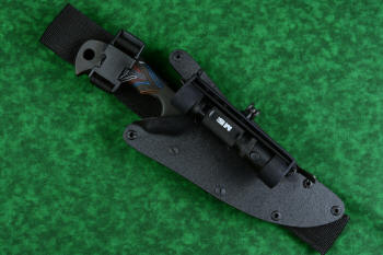 "Ghroth" tactical, counterterrorism, survival knife, sheathed view ith UBLX and HULA accessories in T4 cryogenically treated CPM154 CM powder metal technology high molybdenum stainless steel blade, 304 stainless steel bolsters, multicolored G10 fiberglass/epoxy composite laminate handle, positively locking sheath in kydex, anodized aluminum, anodized titanium, black oxide stainless steel