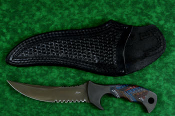 "Ghroth" tactical, counterterrorism, survival knife, obverse side view in T4 cryogenically treated CPM154 CM powder metal technology high molybdenum stainless steel blade, 304 stainless steel bolsters, multicolored G10 fiberglass/epoxy composite laminate handle, heavy 9-10 oz leather shoulder sheath with nylon stitching and black oxide stainless steel reinforcements