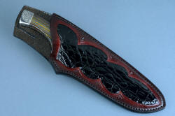 "Golden Eagle" fine custom  handmade knife, sheathed view. Sheath is deep, with a high back for protection, fully inlaid with Caiman skin, finely stitched with polyester.